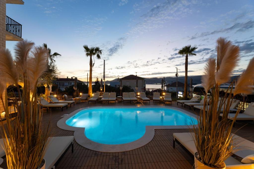 Hotel Vagabundo pool terrace at sunset in Okrug Gornji near Trogir